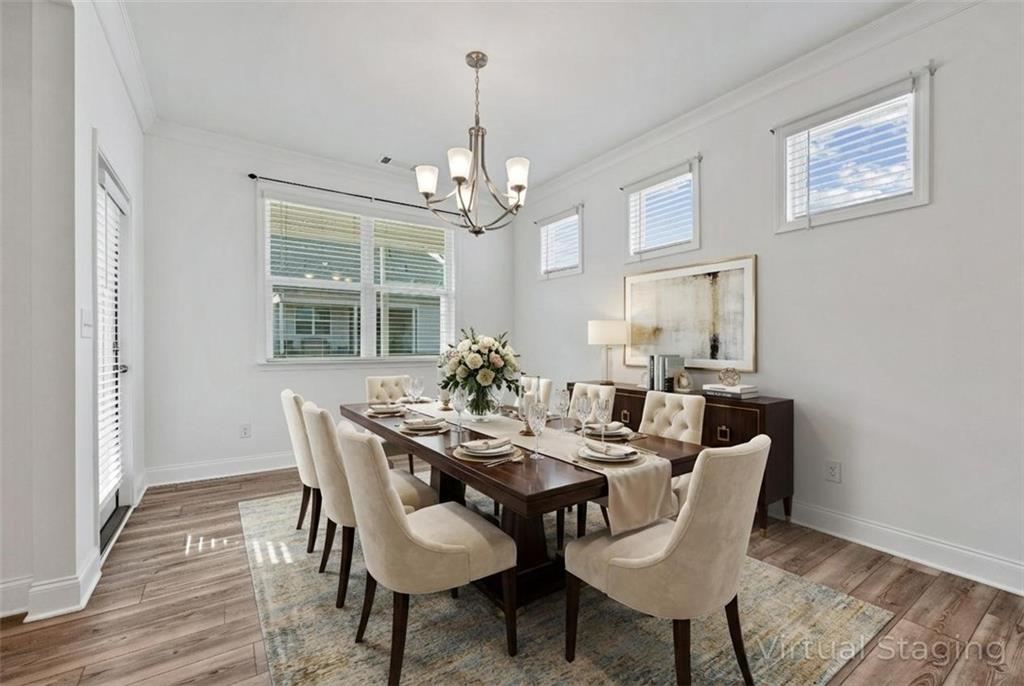 1204 Tahoe Place Canton, GA 30114 - Photo 7 of 73 a view of a dining room with furniture window and wooden floor