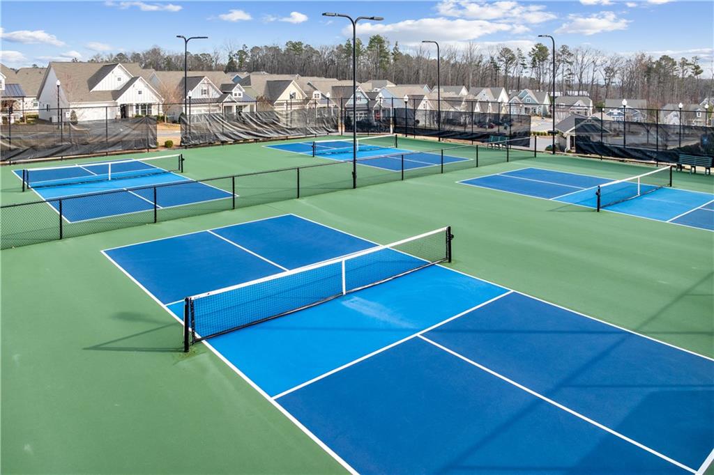 1204 Tahoe Place Canton, GA 30114 - Photo 72 of 73 a view of a tennis ground with large trees