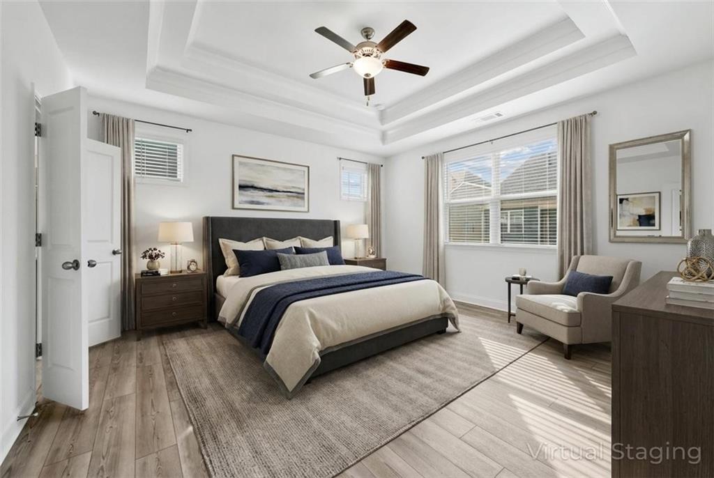 1204 Tahoe Place Canton, GA 30114 - Photo 8 of 73 a bedroom with a bed couch and a window