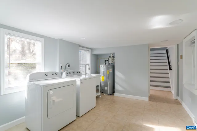 a view of storage and utility room with washer and dryer