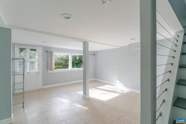 a view of an empty room with a window