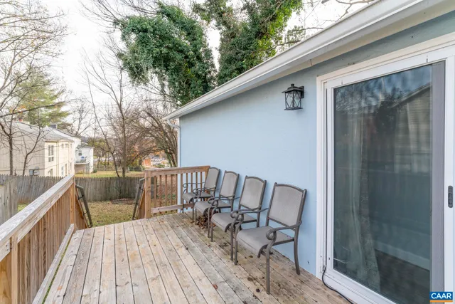 a view of balcony with furniture and wooden deck