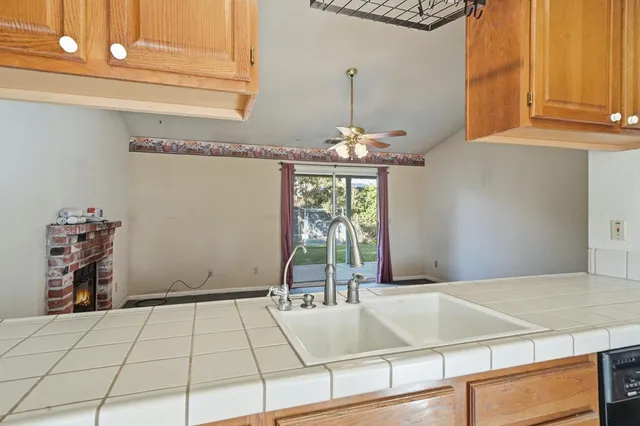 a view of a livingroom with a projector & cabinets