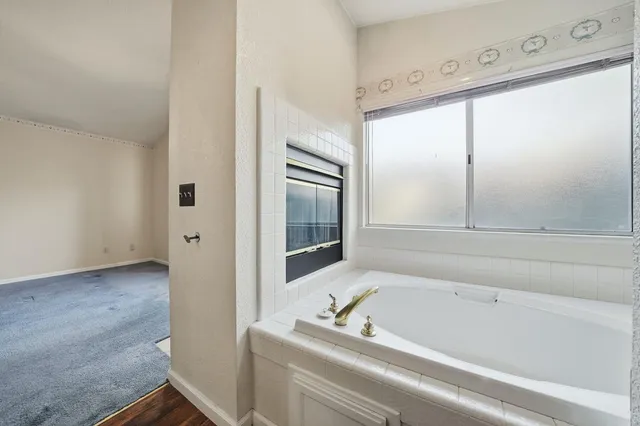 a backyard of a house with table and chairs