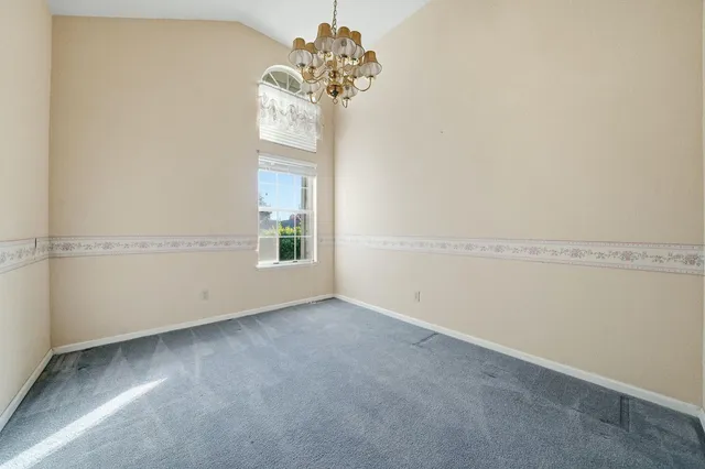 a view of a kitchen with a sink and a cabinet