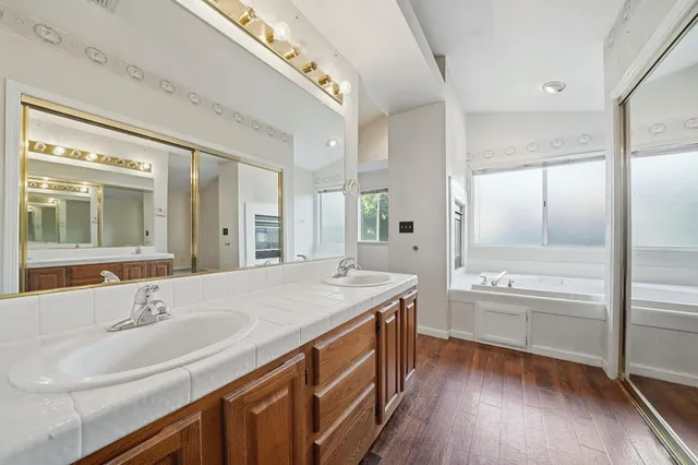 a view of a park with large trees