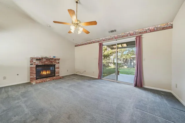 a kitchen with stainless steel appliances granite countertop a sink and a refrigerator