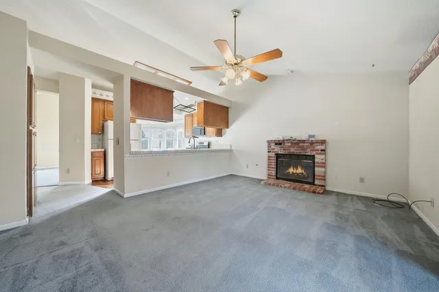 a kitchen with stainless steel appliances a stove sink microwave and cabinets