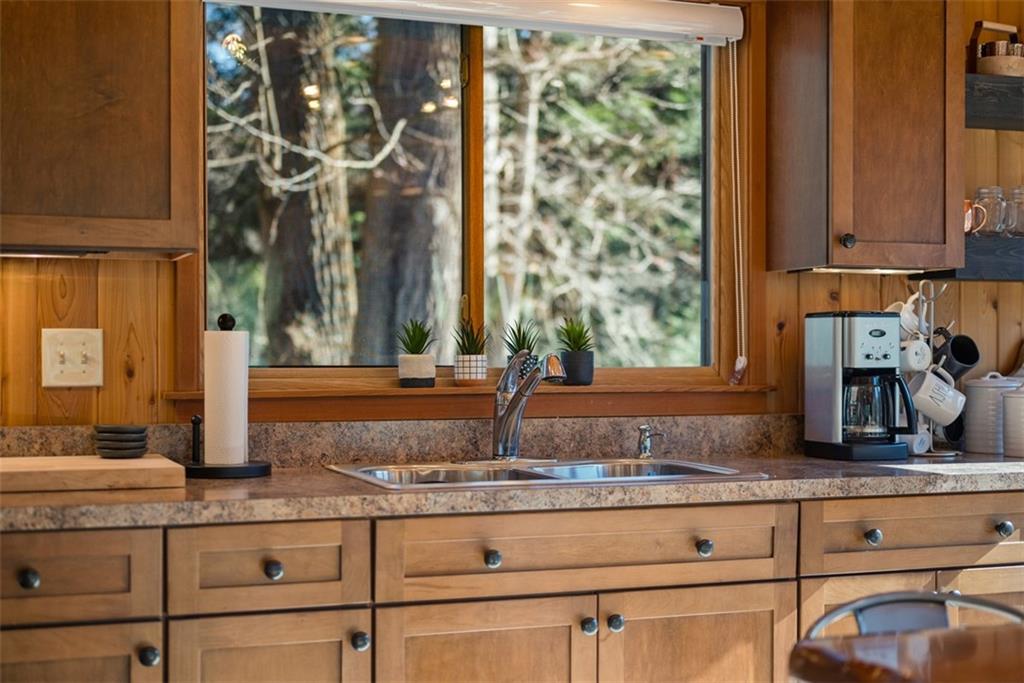 192 Mountain Laurel Road Emlenton, PA 16373 - Photo 15 of 50 Shaker style cabinets with soft close doors and drawers adorn this kitchen. Notice the large picture window that overlooks the grounds.