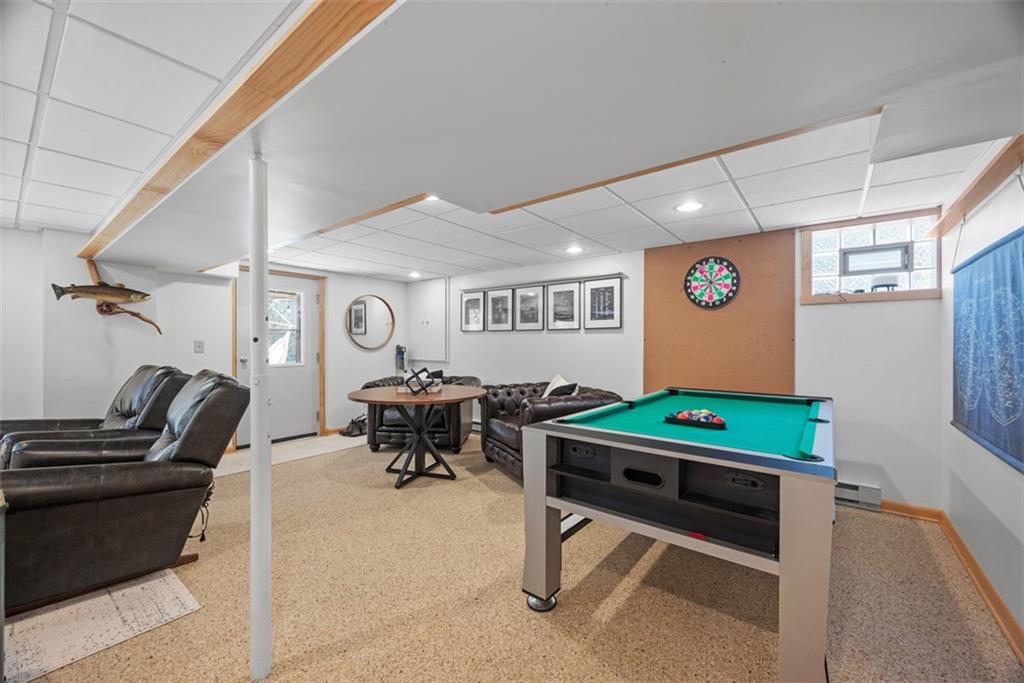 192 Mountain Laurel Road Emlenton, PA 16373 - Photo 25 of 50 Step downstairs to find the spacious game room with nature stone durable flooring.