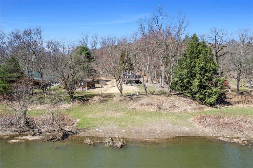192 Mountain Laurel Road Emlenton, PA 16373 - Photo 48 of 50 This sprawling property has gentle slopes that lead to the waterfront.