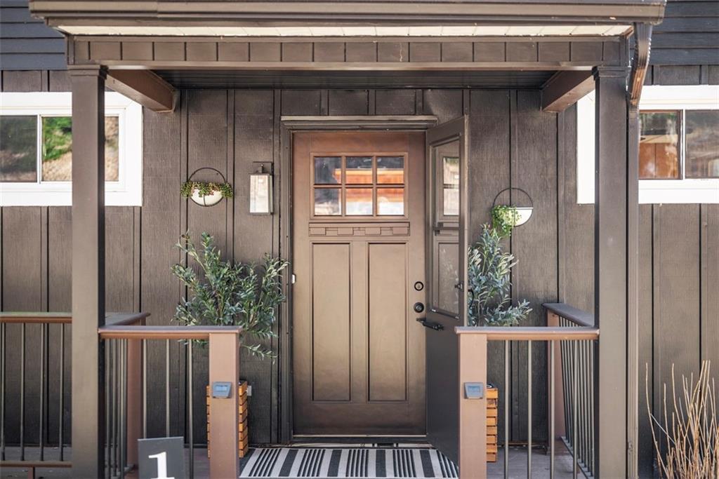 192 Mountain Laurel Road Emlenton, PA 16373 - Photo 6 of 50 A warm welcome is felt as you approach this covered porch entry with charming sconces and craftsman style front door. Vinyl railings and composite decking is a huge plus!
