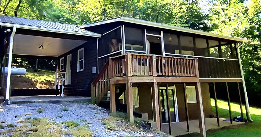 911 Tipton Road Blue Ridge, GA 30513 - Photo 2 of 20 a view of a house with a porch