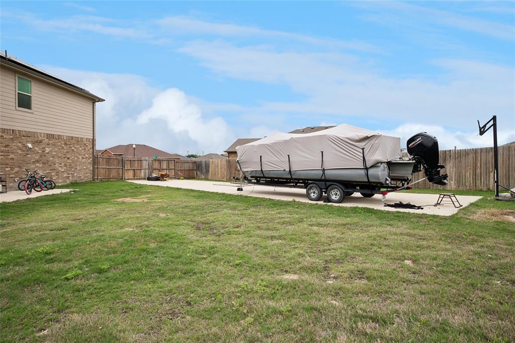 324 Fairgrounds Lane Ponder, TX 76259 - Photo 25 of 40 a view of a house with a backyard porch and sitting area