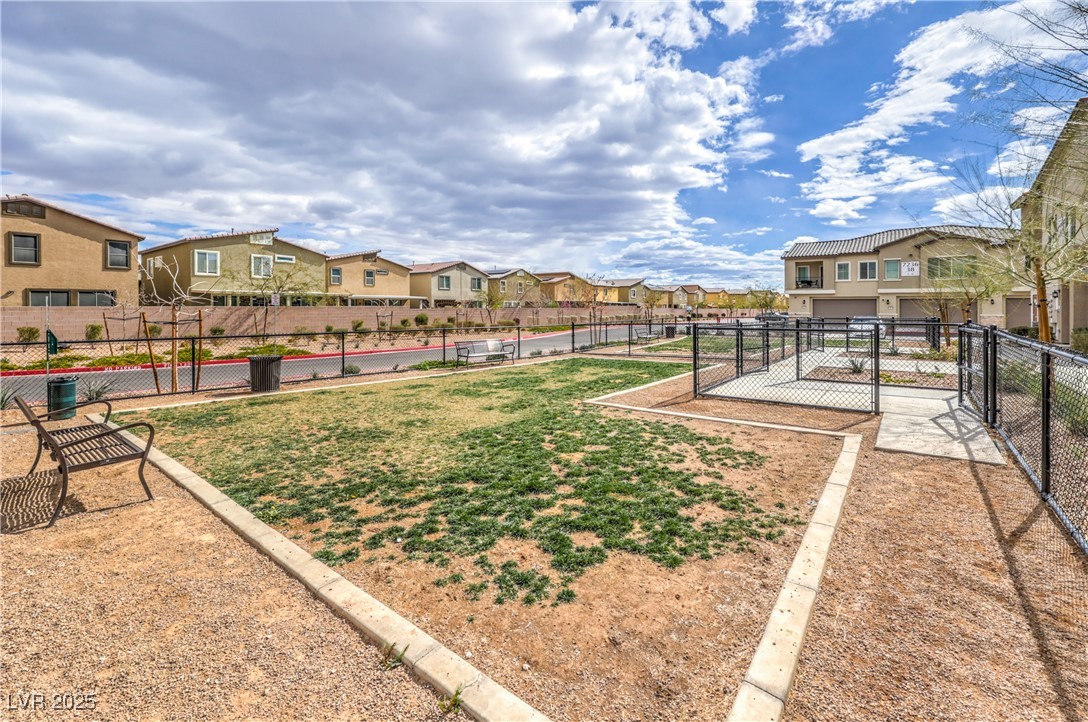 7232 North Decatur Boulevard, Unit 4 North Las Vegas, NV 89084 - Photo 36 of 36 View of yard with a residential view and fence