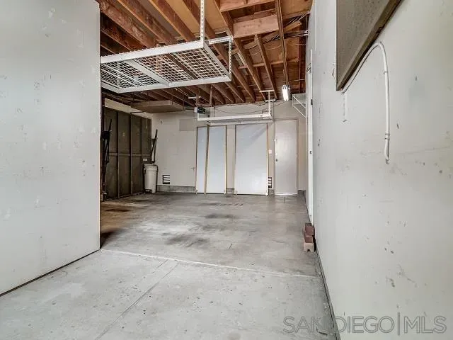 a view of a room with wooden walls