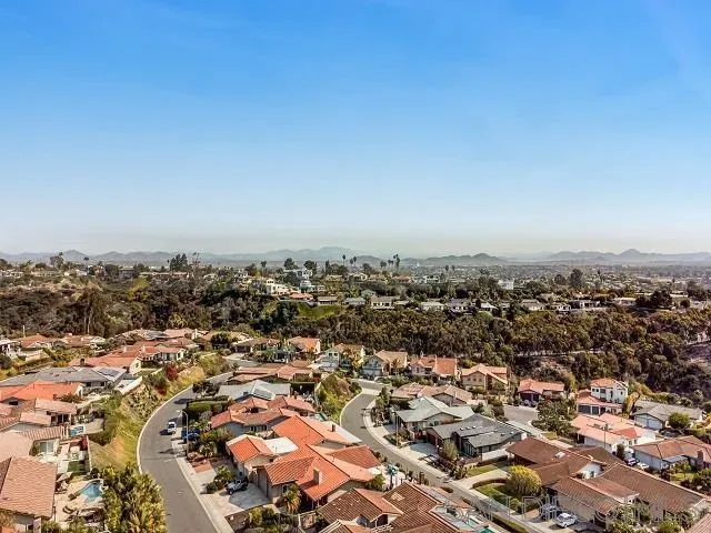 an aerial view of a residential apartment building with a yard
