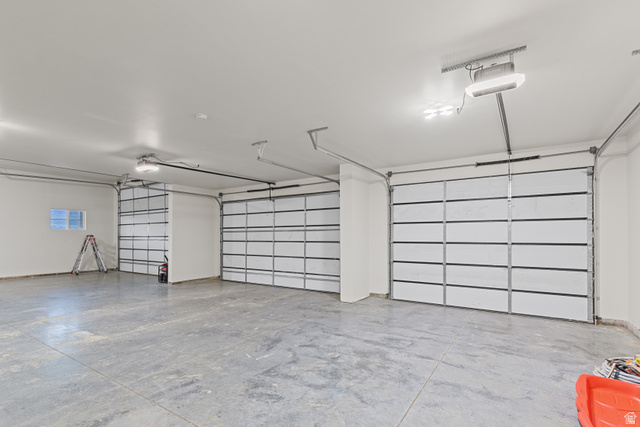 2920 West Temple Cyn Road Laketown, UT 84038 - Photo 58 of 69 Expansive Garage. over 2000sq feet. 6 car capacity and RV height pull through.