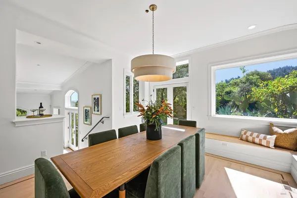 a view of a dining room with furniture window and outside view