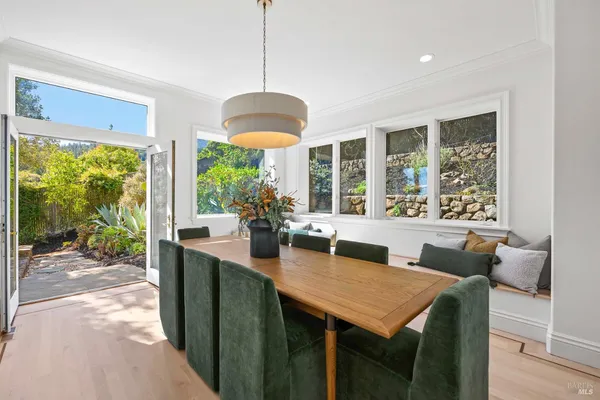 a view of a dining room with furniture window and outside view