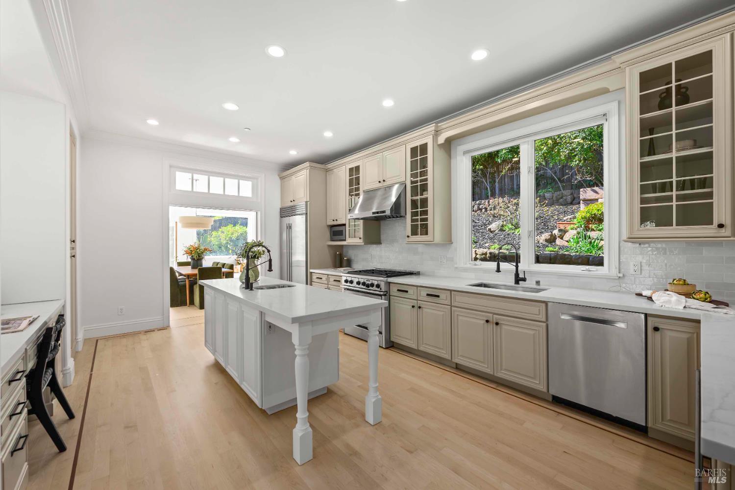 33 Acorn Way Kentfield, CA 94904 - Photo 17 of 58 a large kitchen with cabinets table and chairs