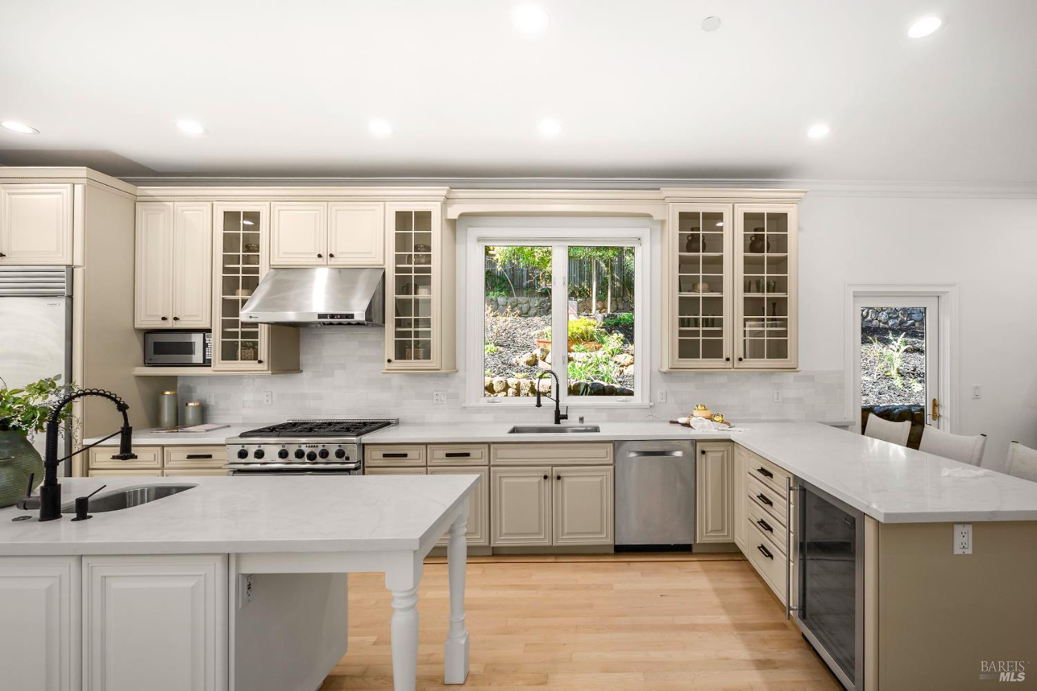 33 Acorn Way Kentfield, CA 94904 - Photo 18 of 58 a kitchen with a sink stove and cabinets