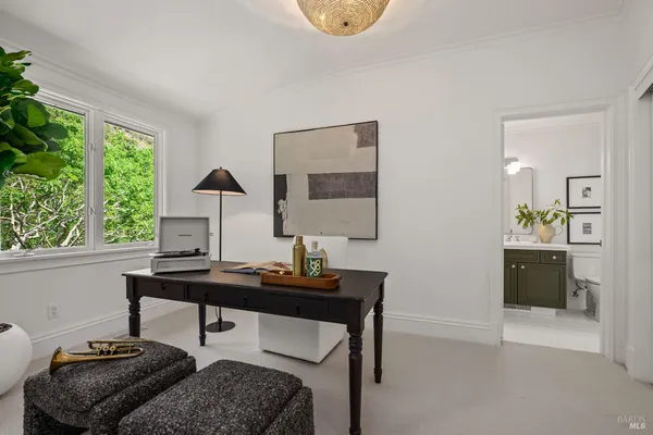 a spacious bedroom with a bed and window