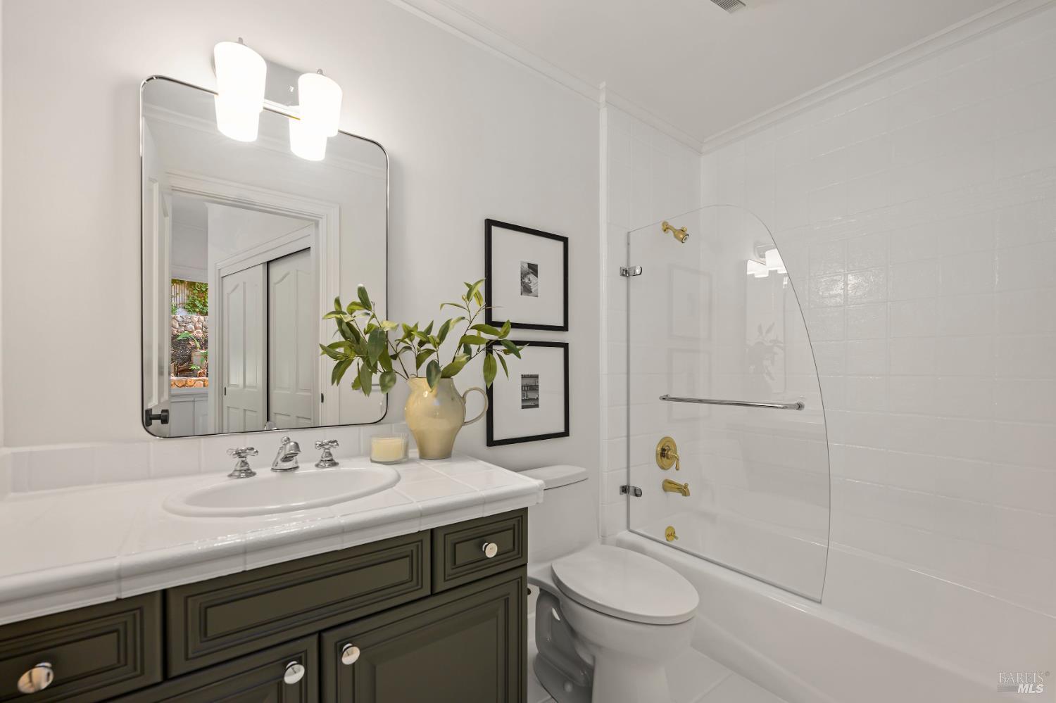 33 Acorn Way Kentfield, CA 94904 - Photo 27 of 58 a bathroom with a granite countertop toilet sink and a mirror