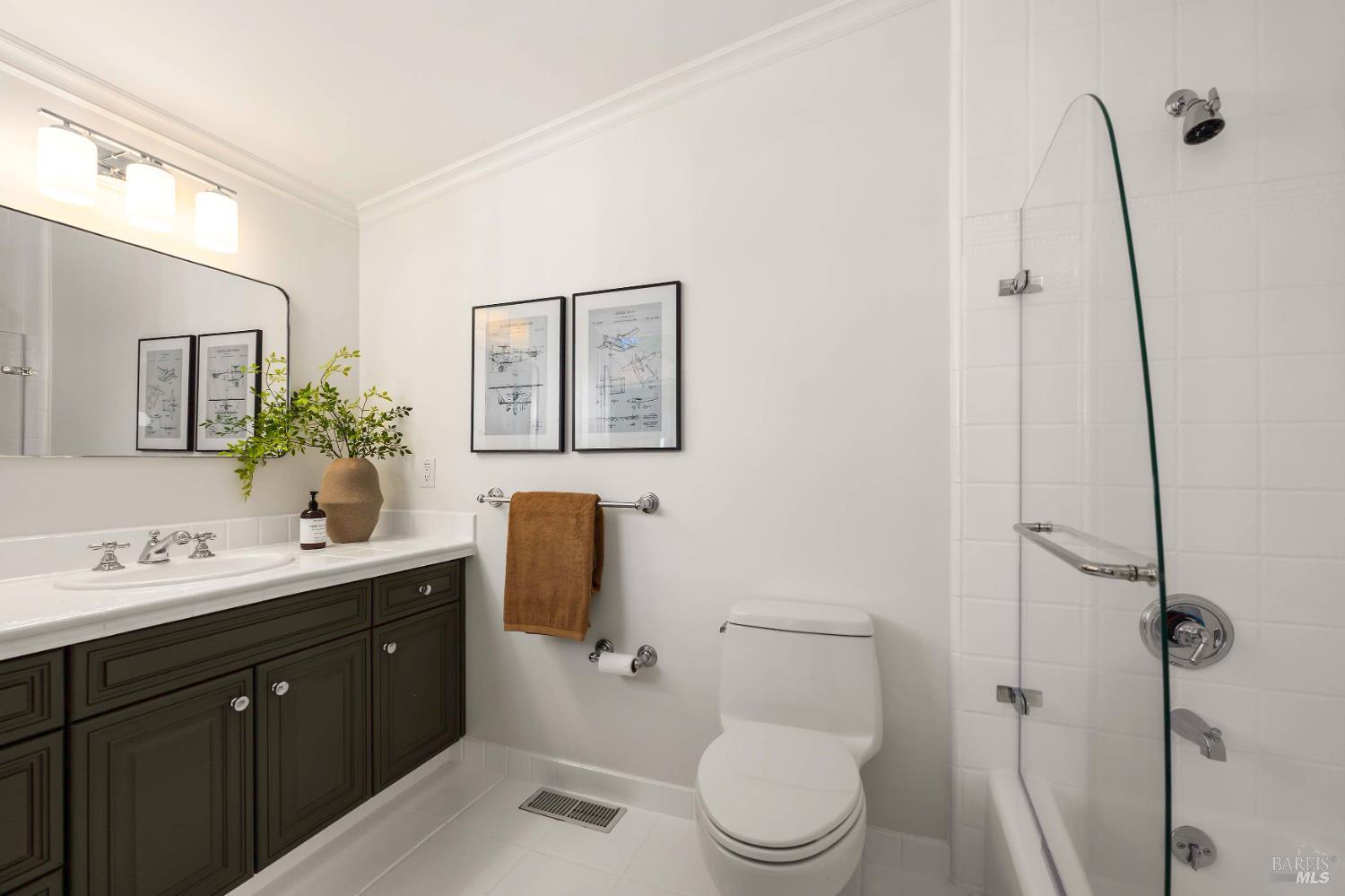 33 Acorn Way Kentfield, CA 94904 - Photo 30 of 58 a bathroom with a toilet a sink a mirror and vanity