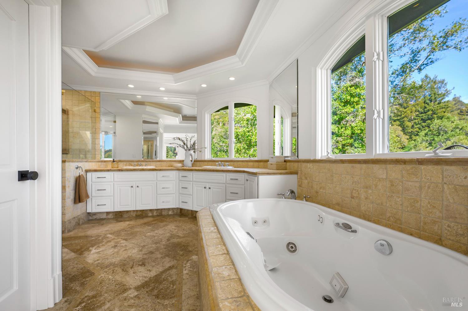 33 Acorn Way Kentfield, CA 94904 - Photo 38 of 58 a bathroom with a tub a sink and a large window
