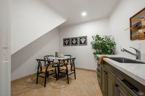 a view of a table and chairs in patio with wooden floor