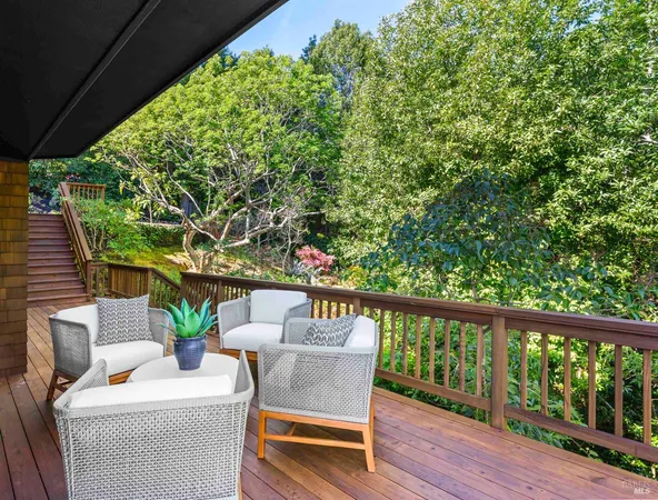 a view of a patio with table and chairs and potted plants