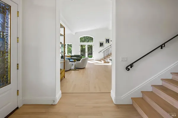 a view of living room with furniture and rug