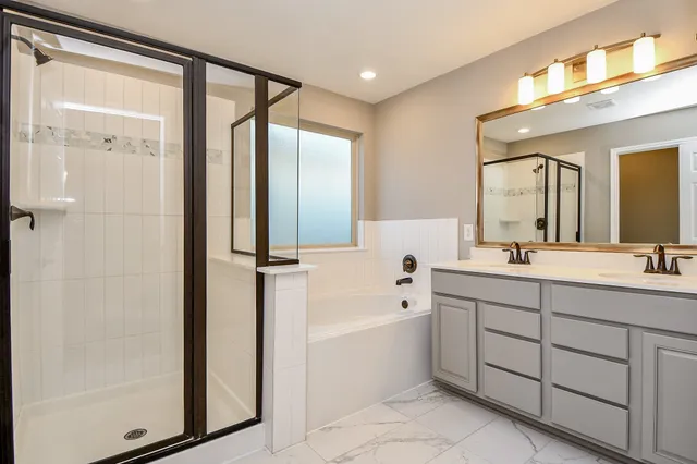 a view of an empty room with cabinet and a window