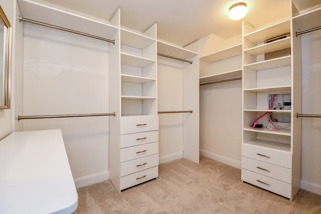 a bathroom with a double vanity sink and mirror