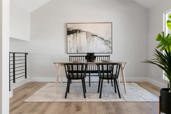 a living room with furniture and a ceiling fan