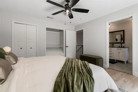 a bedroom with a bed and a walk in closet