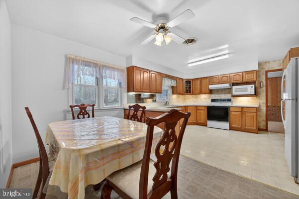 2130 Leon Road Culpeper, VA 22701 - Photo 17 of 47 a view of a dining room with furniture and a chandelier