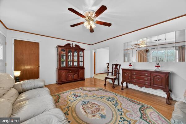 2130 Leon Road Culpeper, VA 22701 - Photo 19 of 47 a living room with furniture a dining table and paintings on the wall