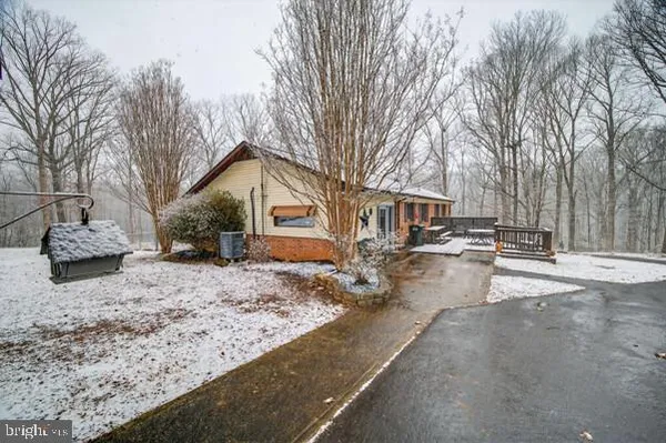 a blue umbrella sitting in front of a house