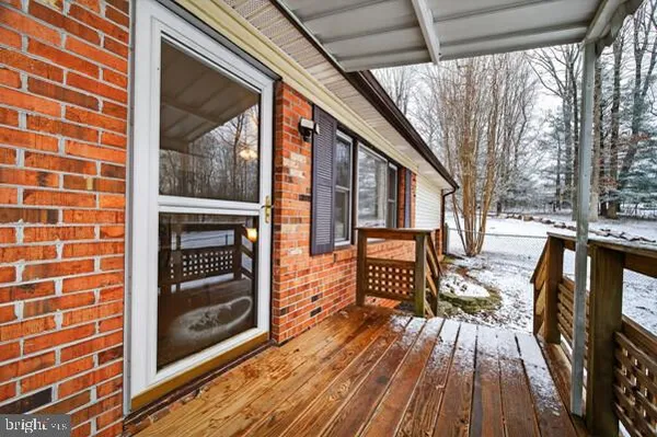 a view of deck with wooden floor and outdoor seating