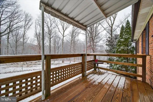 a view of a patio with a table and chairs