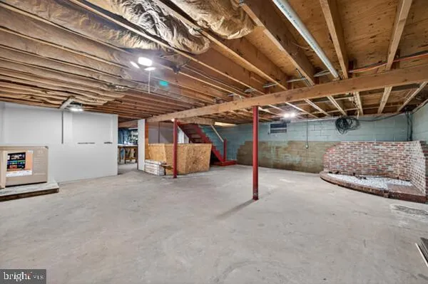 a view of empty room with refrigerator
