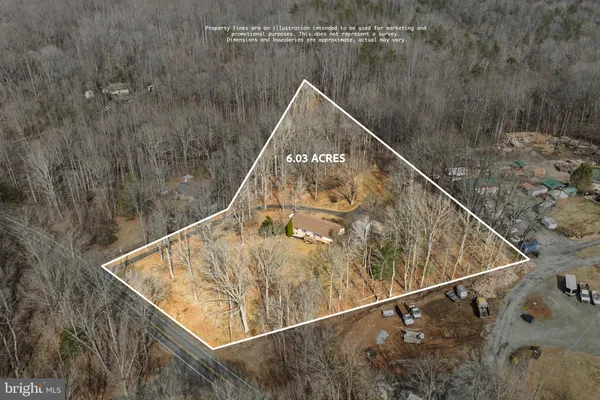 a view of a house with a yard covered in snow