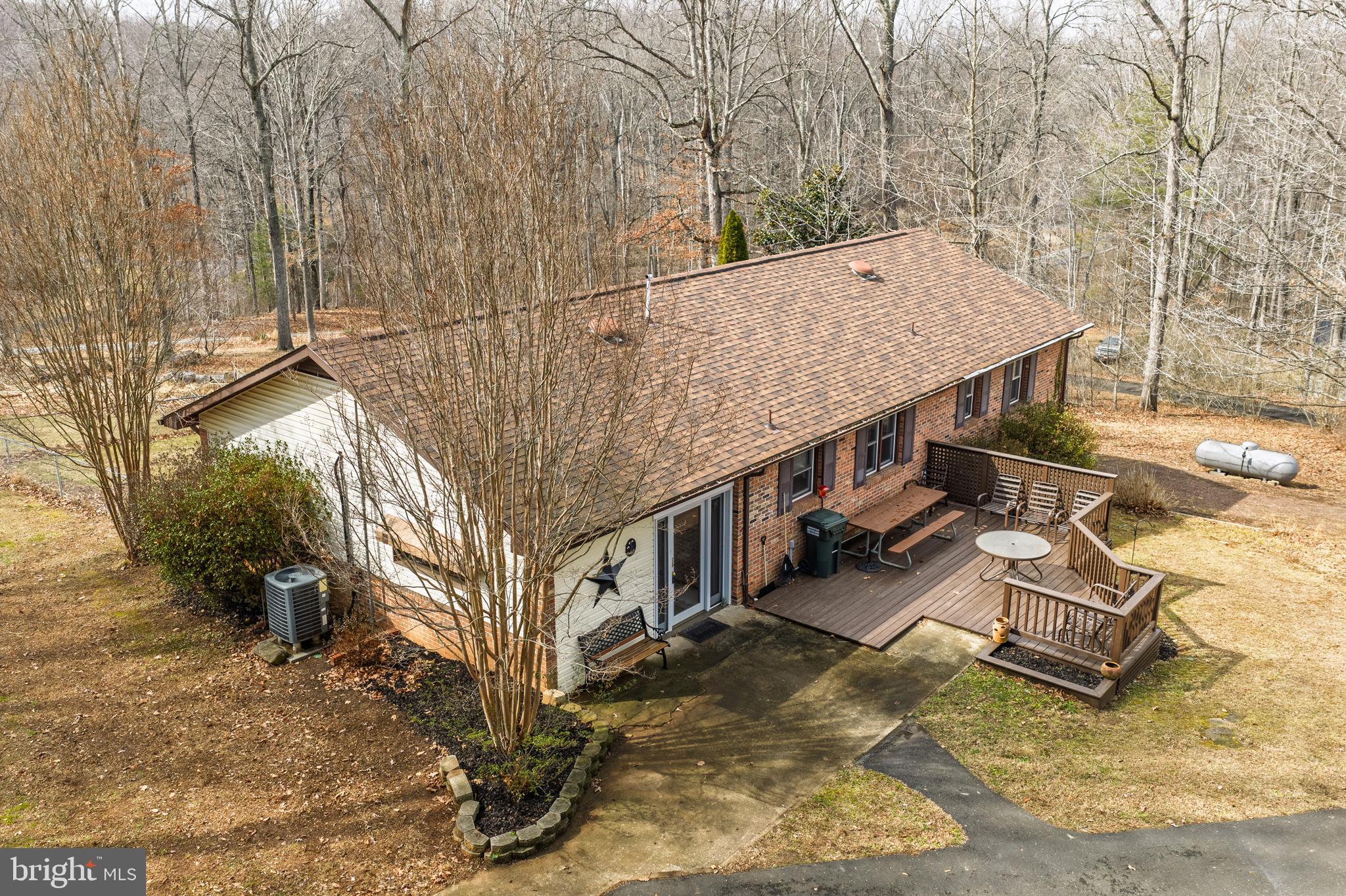 2130 Leon Road Culpeper, VA 22701 - Photo 6 of 47 a view of house with yard and trees in the background