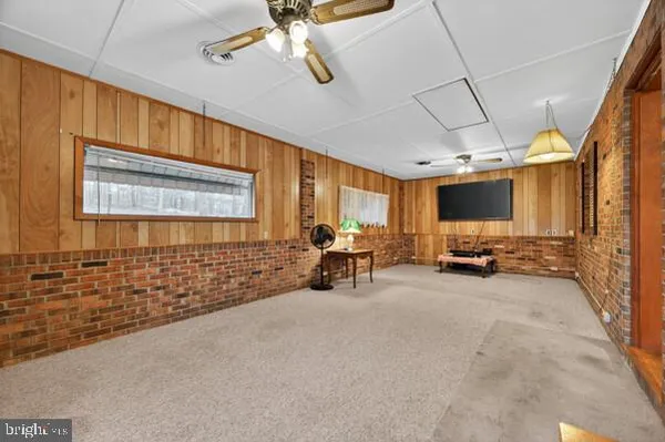 a view of game room with windows