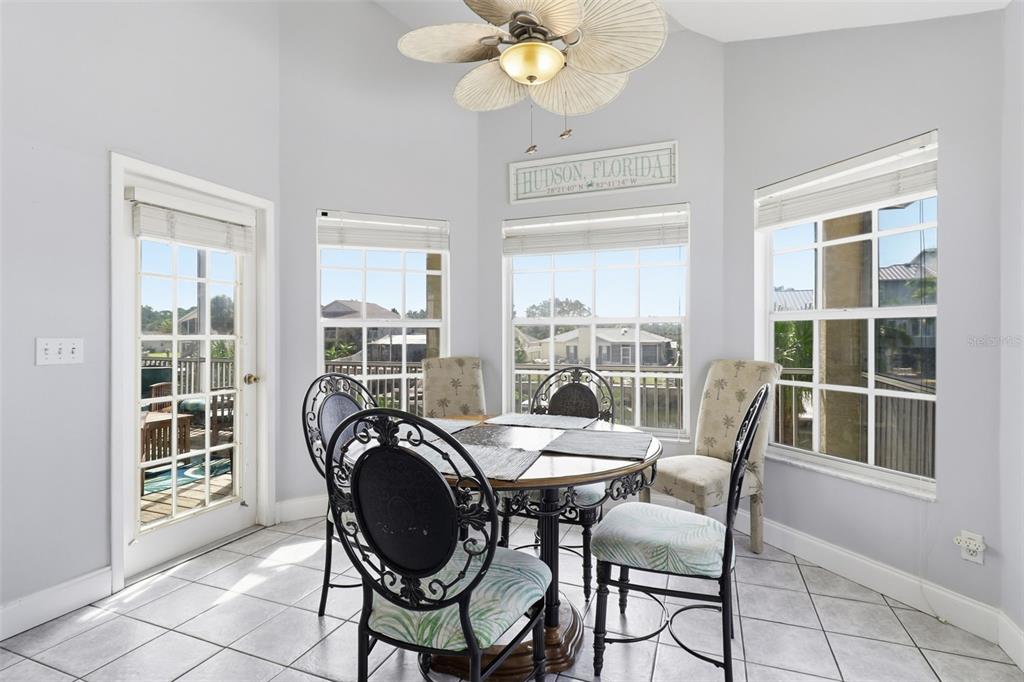 7324 Islander Lane Hudson, FL 34667 - Photo 16 of 35 a view of a dining room with furniture window and outside view