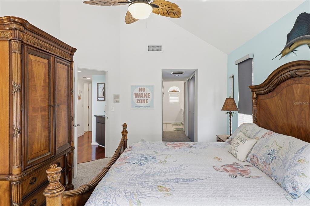 7324 Islander Lane Hudson, FL 34667 - Photo 20 of 35 a bedroom with a bed and a large mirror on the dresser