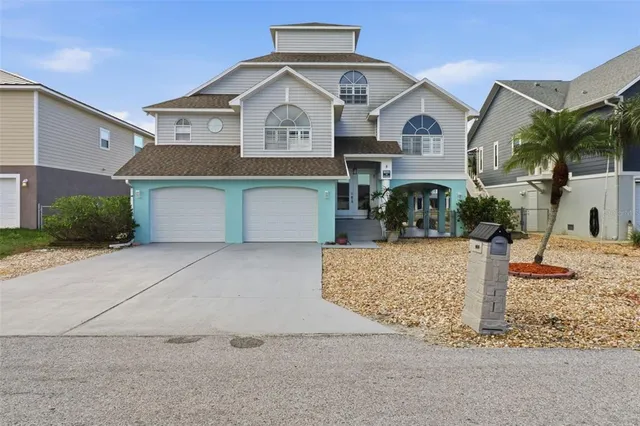 a front view of a house with garage