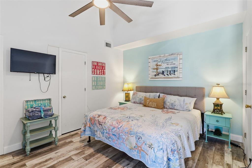 7324 Islander Lane Hudson, FL 34667 - Photo 25 of 35 a bedroom with a bed and a tv